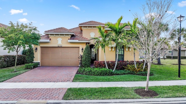 mediterranean / spanish-style house with a garage and a front yard