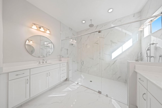 bathroom featuring vanity and an enclosed shower