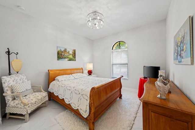 bedroom featuring a chandelier