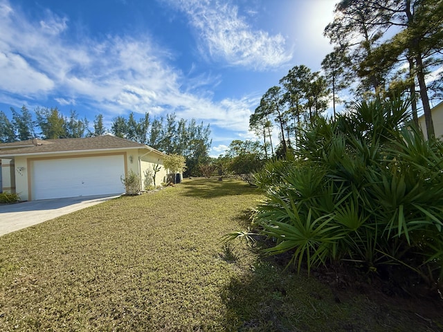 view of yard with a garage