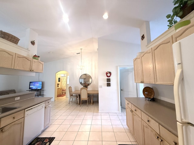 kitchen featuring light brown cabinetry, hanging light fixtures, white appliances, and light tile patterned flooring