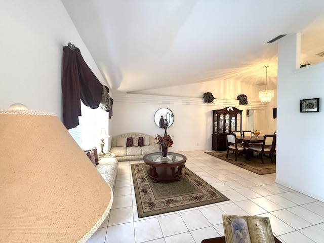 tiled living room with vaulted ceiling and a chandelier