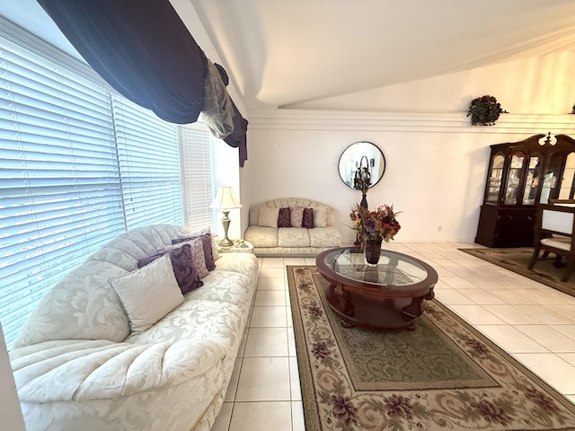 living room with vaulted ceiling and light tile patterned flooring