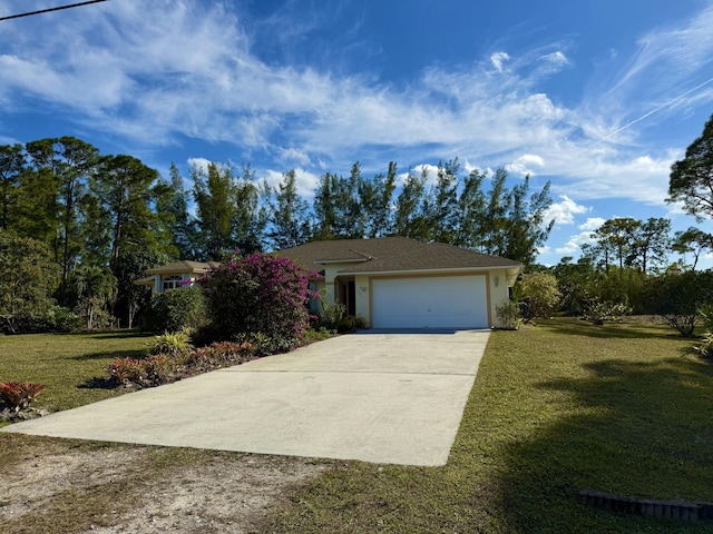 ranch-style house with a garage and a front lawn