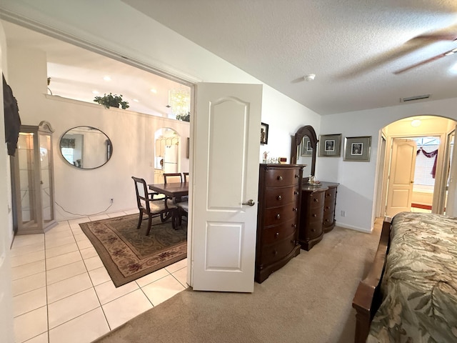 bedroom featuring a textured ceiling and light tile patterned flooring