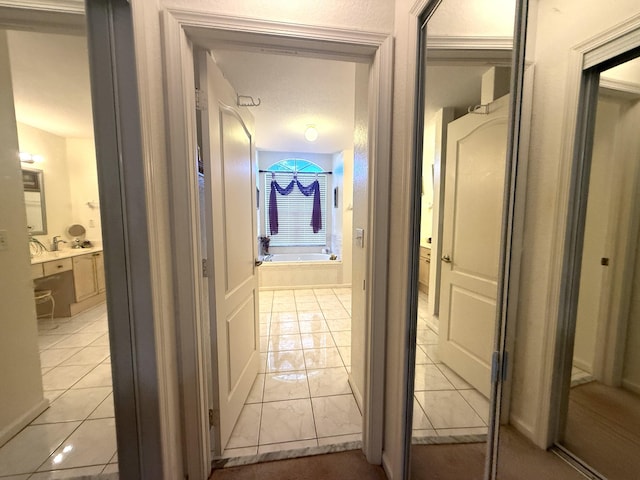 hallway with light tile patterned floors