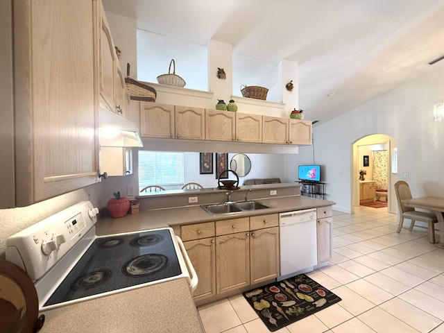 kitchen featuring light tile patterned flooring, high vaulted ceiling, light brown cabinetry, sink, and white appliances