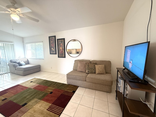 living room with light tile patterned flooring, ceiling fan, and lofted ceiling