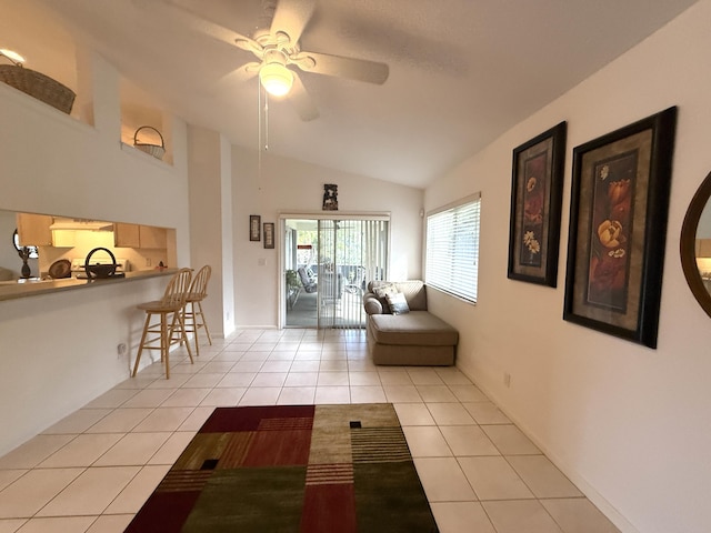 tiled living room with vaulted ceiling and ceiling fan