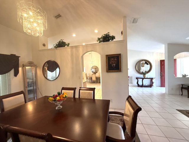 dining space featuring a chandelier and light tile patterned floors