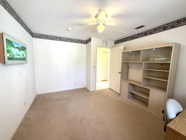 unfurnished bedroom with ceiling fan, carpet flooring, and a closet