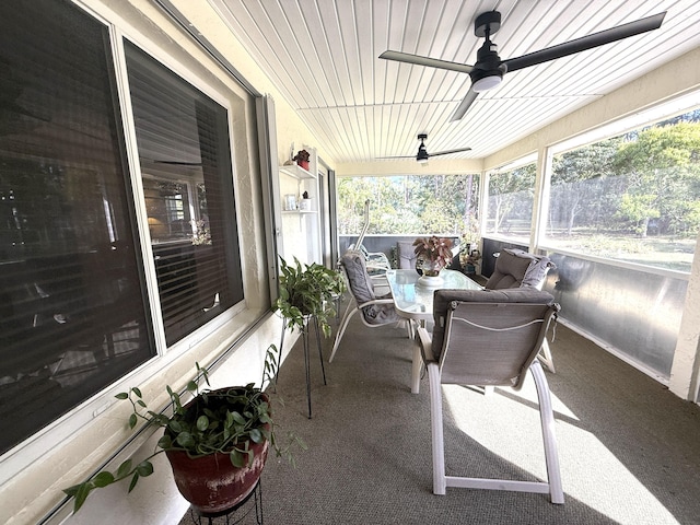 sunroom / solarium featuring ceiling fan