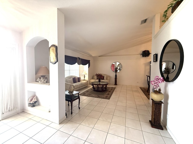 living room with light tile patterned flooring and lofted ceiling