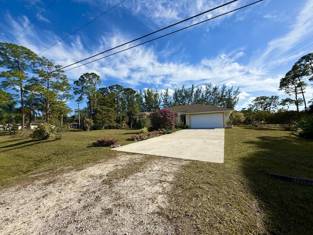 view of front facade with a garage and a front yard