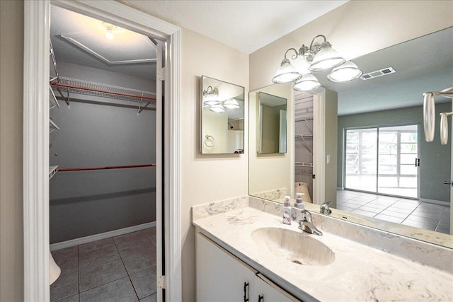 bathroom with vanity and tile patterned flooring