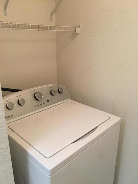 washroom with washer / clothes dryer and laundry area