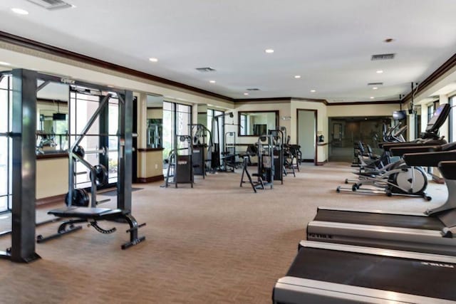 gym with baseboards, visible vents, crown molding, and recessed lighting