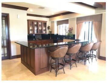 bar with crown molding, indoor bar, and baseboards