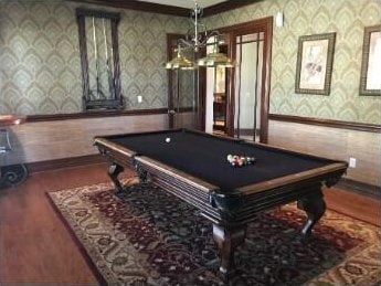 playroom with wood finished floors, pool table, baseboards, and wallpapered walls