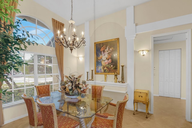 dining room featuring light tile patterned flooring and an inviting chandelier