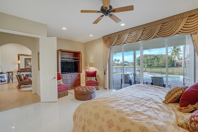 bedroom featuring ceiling fan, access to exterior, and multiple windows