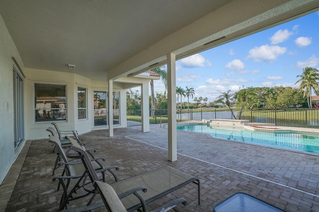 view of pool with a patio and an in ground hot tub