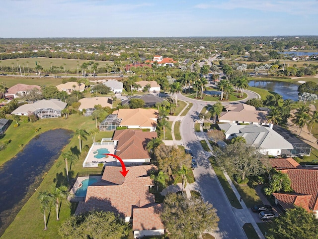 drone / aerial view with a water view