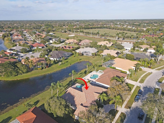 birds eye view of property featuring a water view