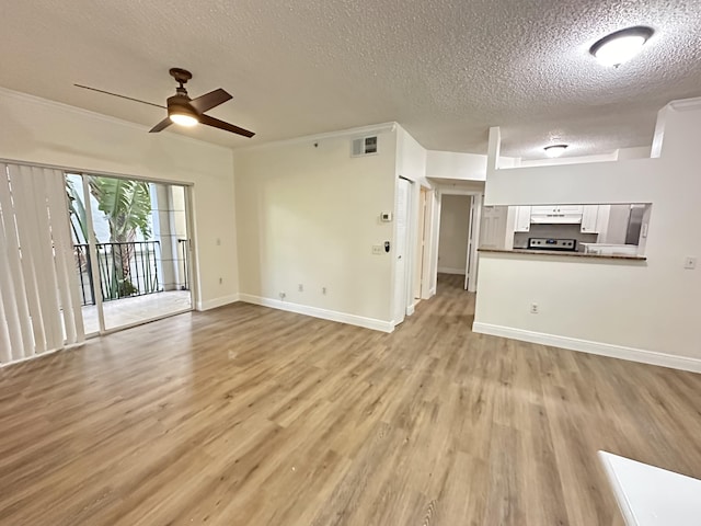 unfurnished living room with ceiling fan, a textured ceiling, and light hardwood / wood-style flooring