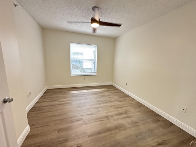 unfurnished room with hardwood / wood-style floors, a textured ceiling, and ceiling fan