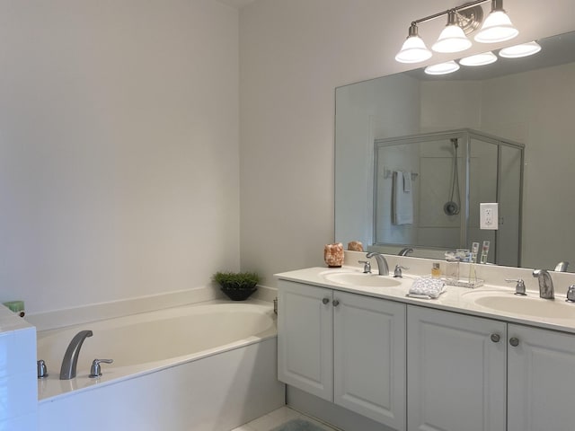 bathroom with vanity and separate shower and tub