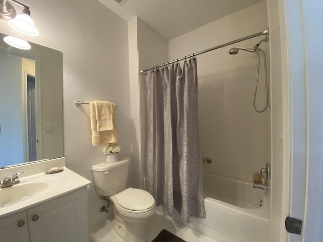 full bathroom featuring vanity, shower / bath combo with shower curtain, and toilet