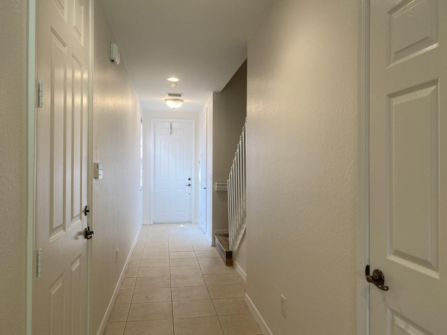 hallway with light tile patterned flooring