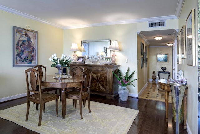 dining space with crown molding and dark wood-type flooring