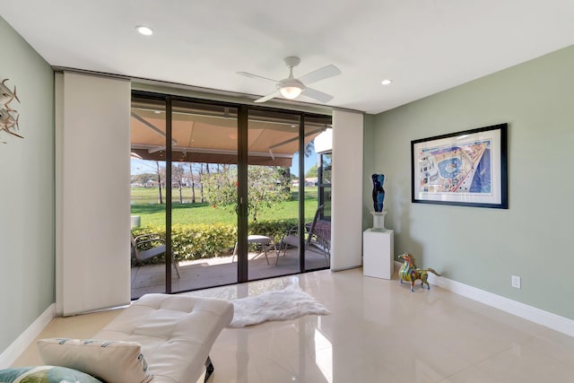 interior space featuring floor to ceiling windows and ceiling fan