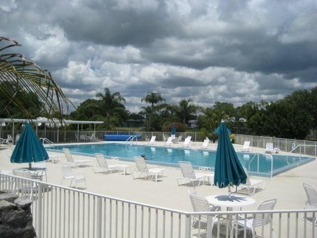 view of swimming pool with a patio area