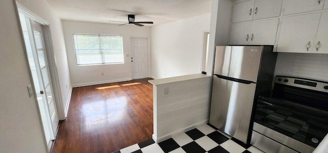 kitchen featuring backsplash, stainless steel appliances, white cabinets, and ceiling fan