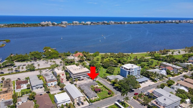 birds eye view of property featuring a water view