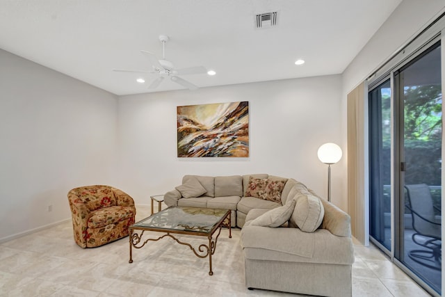 living room with light tile patterned floors and ceiling fan