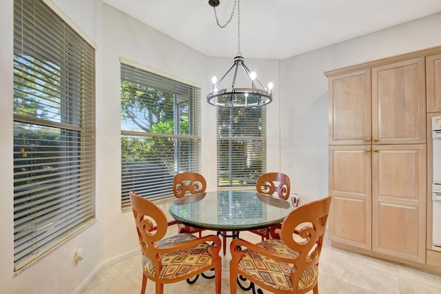 dining room featuring a notable chandelier