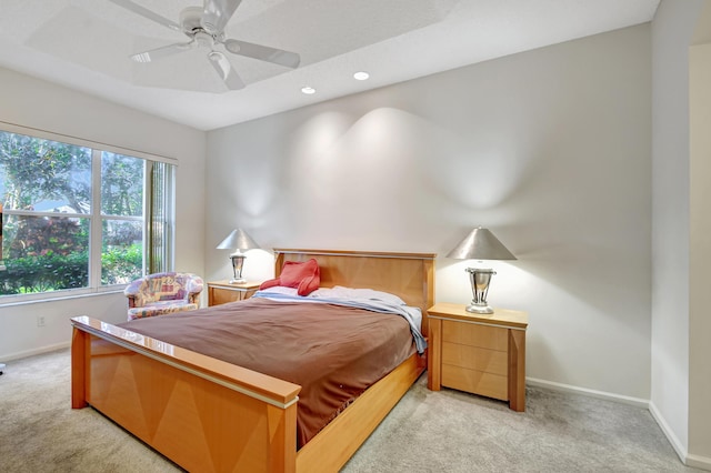 bedroom with light colored carpet and ceiling fan