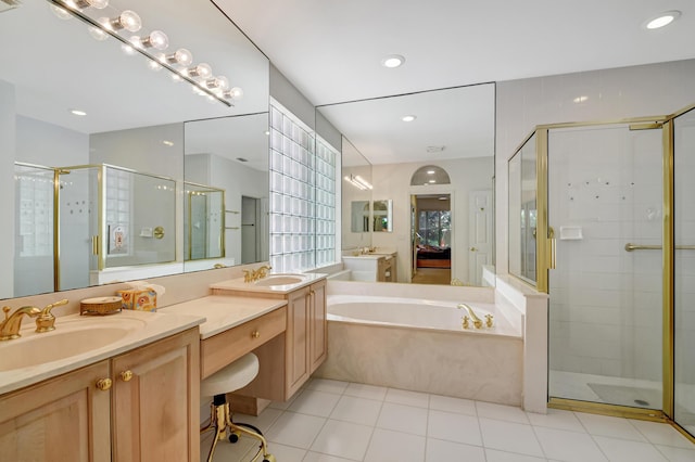 bathroom with vanity, plus walk in shower, and tile patterned flooring