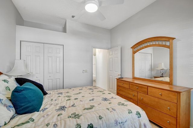 bedroom with ceiling fan and a closet