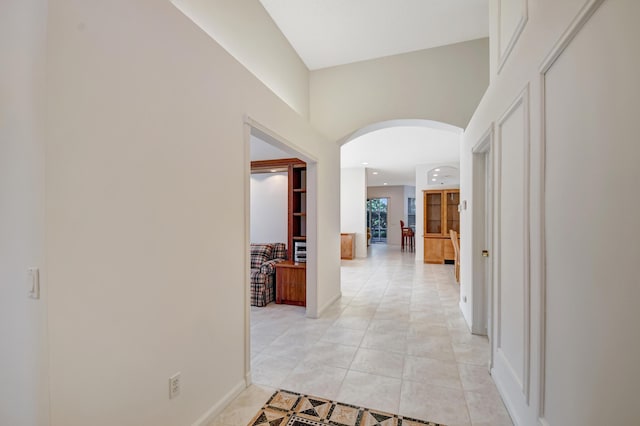 hallway featuring light tile patterned floors