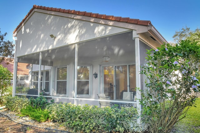 back of house with a sunroom