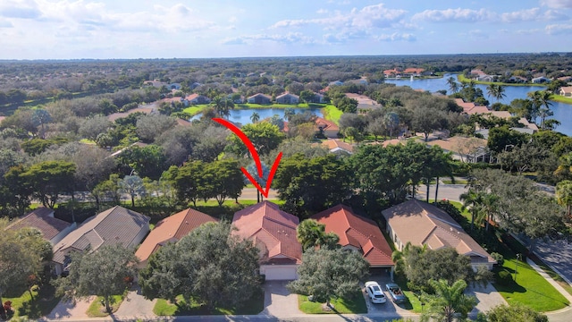 birds eye view of property featuring a water view