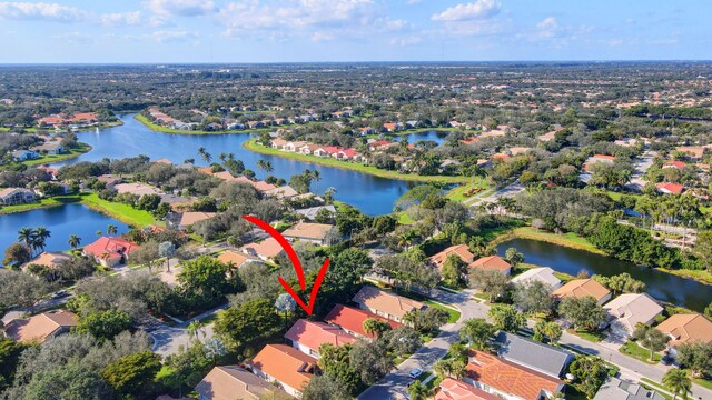 birds eye view of property featuring a water view