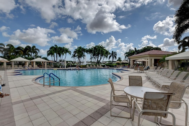 view of swimming pool with a gazebo and a patio