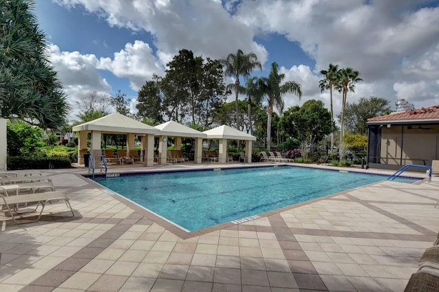 view of swimming pool with a gazebo and a patio