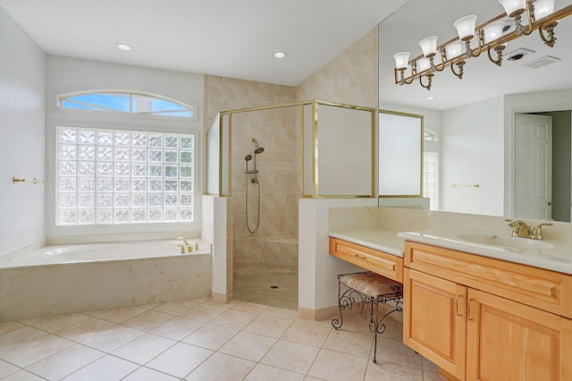 bathroom with plenty of natural light, a shower stall, and tile patterned floors